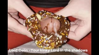 Big dick pushes through frosty donut and big balls make a huge cumshot