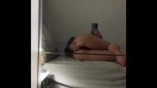 Masturbating in front of a mirror