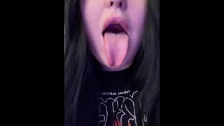 Pretty brunette shows her tongue