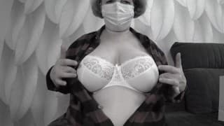 A mature BBW milf with big natural saggy tits tries on bras.