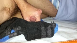 Twink cumming a big load onto some sports socks after gym